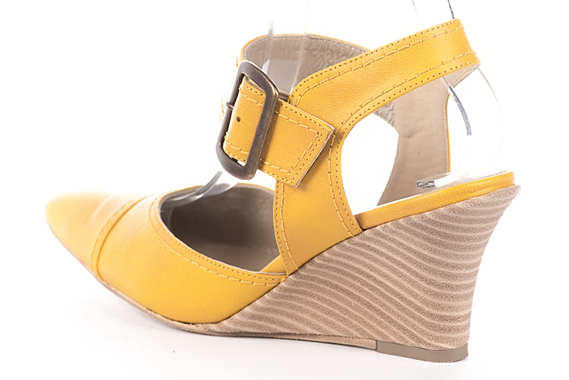 Mustard yellow women's open back shoes, with an instep strap. Tapered toe. Medium wedge heels. Rear view - Florence KOOIJMAN